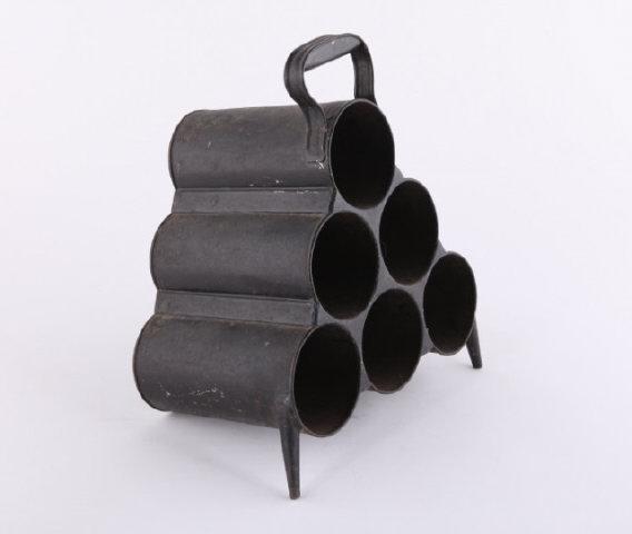 Metal Wine Bottle Carrier, Dublin, 19th Century: A mid-19th century metal wine bottle carrier for six bottles of your finest vintage. Makers metal label on the top mostly indistinguishable but made in Dublin, Ireland. H : 16"; W : 14".