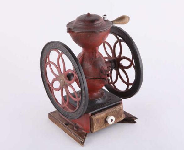 Cast Iron Coffee Grinder, Philadelphia, 19th C.: A cast iron Enterprise coffee grinder, Philadelphia, patent 187. Cast iron with original red paint and the original wooden drawer with porcelain knob. American, 19th century. H: 15"; W: 9.5". Collecti