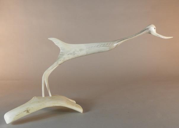 Carving of a Bird, Nunavut: Probably Abraham Ukuqtunnuaq (Ohaktoonooak) (1944-), male, Taloyoak (Spence Bay), Nunavut, bird, c. late 1990s, antler, signed "ABE O". A fairly well known carver represented in several exhibitions si