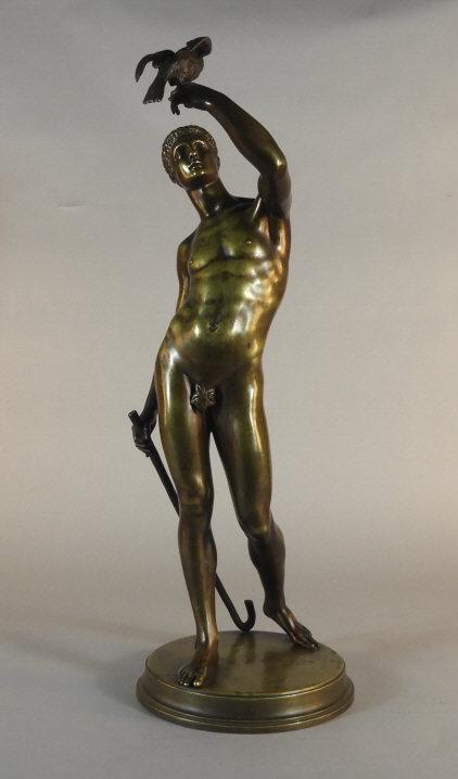Gaston GIUTTON (1825-1891) French: Gaston Giutton, a fine 19th century gilt patinated full length bronze listed as "L'Homme a L'Oiseau" (Man with Bird), portraying a young man holding a dove. Standing upon a circular plinth base, signe