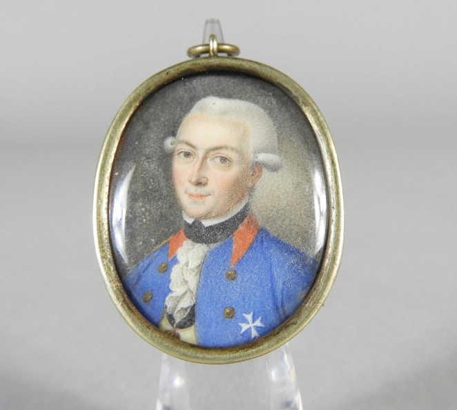 Military Portrait Miniature, German, 18th Century: An 18th century military portrait miniature, executed in watercolour depicting a German officer in a blue tunic, unsigned and mounted within an oval silvered locket (ill fitting). Inscribed Lothar Wil