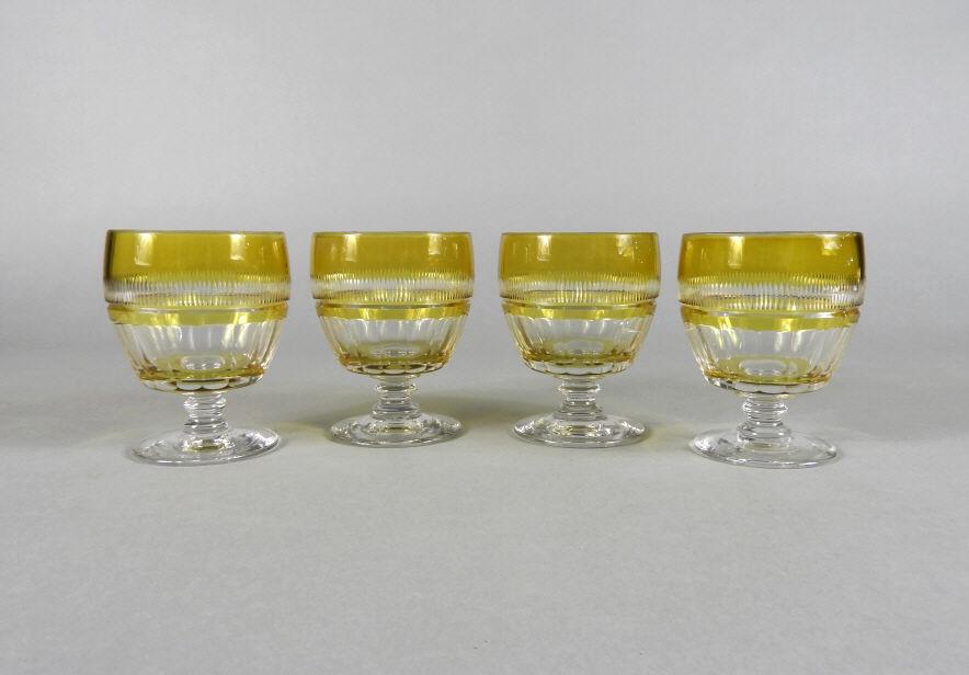 Pressed Glass Cut-to-Clear (Yellow) Rummers: A group of 4 antique pressed glass rummers with yellow cut -to-clear bodies. All raised on short stems atop a circular spreading foot. Dimensions, 4.5" high x 3.25" diameter.