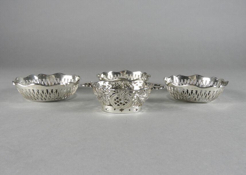 Small Sterling Silver Baskets: A group of 4 small sterling silver baskets, 3 of circular form with pierced bodies and hallmarked Birmingham 1927 with makers marks for Mappin and Webb measuring 4" diameter, together with a small con