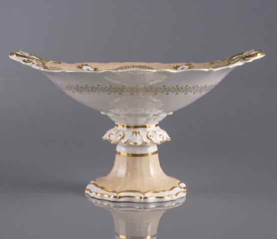 Mid Victorian Porcelain Tazza: A mid Victorian porcelain tazza, cream colour ground with hand-painted flowers & gilt, British Antique Dealers' Association (BADA) label, 8" h x 13" w x 11 1/2" w.