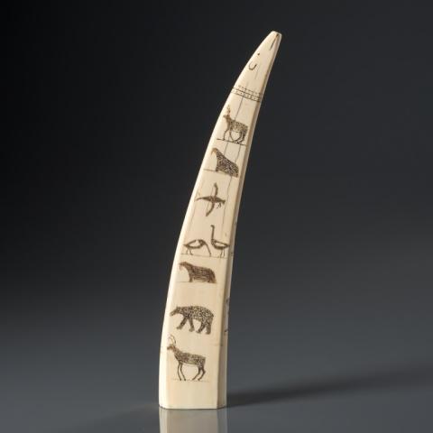 UNIDENTIFIED ARTIST, TOTEM STYLE ART, CAPE DORSET: Unidentified artist, Cape Dorset, very good & early engraved natural material, with portraits of figures on one side, birds & animals on the reverse; boots, fish & geometric designs along the edges, t