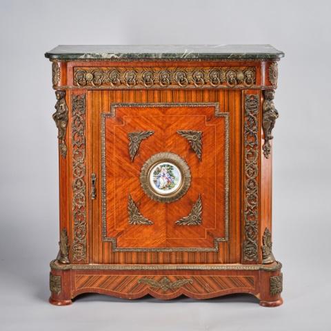 Louis XVI Style Commode: A Louis XVI style kingwood commode, having gilt mounted case with a single drawer and door, a central inset printed ceramic plaque on the door echoed by smaller ones along the sides, and a frieze of l