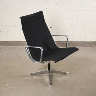 MCM EAMES ALUMINUM 'GROUP CHAIR' FOR HERMAN MILLER: USA circa 1960, the swiveling aluminum frame fitted with a black panelled cushion, raised on four splayed supports, measuring 35" high x 24" wide (seat height 18")