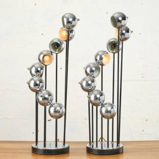 PAIR OF MCM CHROME TABLE LAMPS BY ROBERT SONNEMAN: USA circa 1960, both showing eight graduated, ascending chromed spherical pots mounted on metal posts rising from chromed metal circular bases. Measuring 33.5" high x 9.5" diameter.