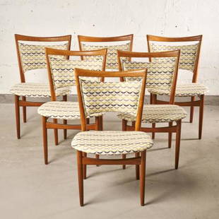 SIX MCM TEAK DINING CHAIRS BY FINN JUHL: For Soren Willadsen, Denmark circa 1960, the frames showing upholstered backrests & seats, raised on rear stile supports & turned front supports, measuring 32" high x 20" wide (seat height 17.5") .