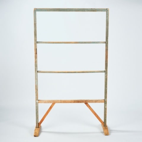 FOOTED QUILT STAND: In original blue paint, nice turnings on rack. 19th century. Measuring, 58" height x 34” width. The Carol Telfer Collection.