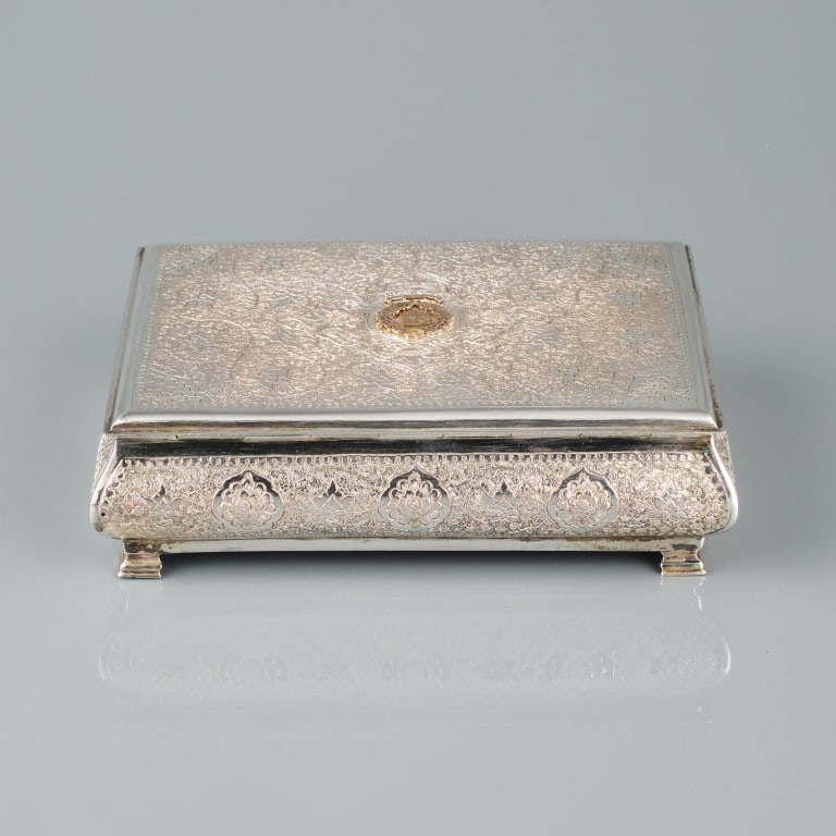 PAKISTANESE SILVER ENGRAVED BOX: A good silver engraved box with the Pakistan State Emblem on the lid and cedar lined, marked "PAKSILVER'. With original presentation box. Measuring 2 1/4 x 7 5/8 x 5 /8 inches, weight 739 grams. Prove