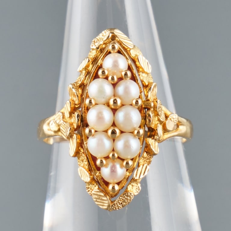 18K GOLD REVERSIBLE RING: An 18K yellow gold reverse ring showing eight seed pearls on one side, and a rhodonite stone(untested) on the other. Total weight 6.3 grams.