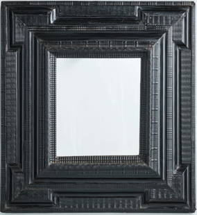 EBONIZED RIPPLE MOULDED WALL MIRROR: Flemish circa 1740, the squared black lacquered frame with wavy molded veneers, with a raised rectilinear molding framed by quartered spandrels, surface abrasions, the reverse showing later alteration