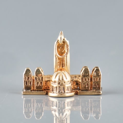 10K GOLD CANADIAN PARLIAMENT PENDANT: A 10K yellow gold 'Canadian Parliament Ottawa' tri-dimensional pendant marked for Birk(s). Weight 9.2 grams.