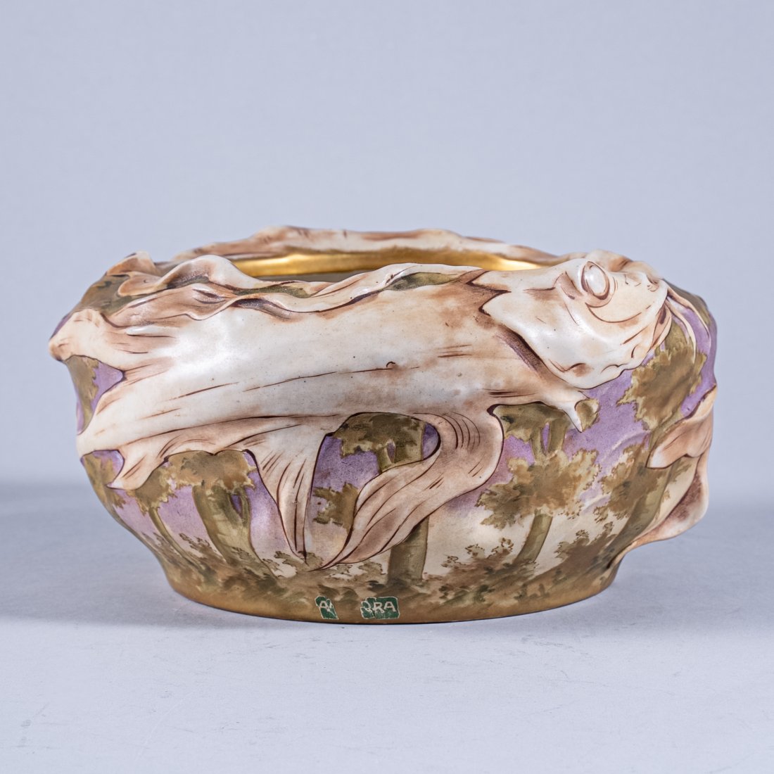 RARE AMPHORA FISH THEMED BOWL: Austria 1900, circular bowl decorated with a matte glaze and organic inspired 'grotesque' piscine motifs, gilt rim and impressed marks at base "Amphora Faience, Turn", measuring 10 inches diameter.