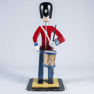 Kay BOJESEN (1886 - 1958) Danish: A rare Danish Royal Guard Drummer, circa 1940, carved painted wood, measuring 40" high x 15 1/2" wide x 10" deep. Condition: overall good condition, light wear to back of helmet, some paint peeling to