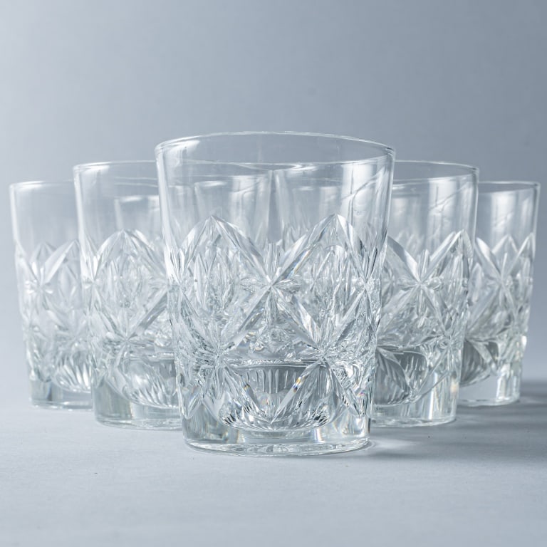 WHISKY GLASSES: A set of eight Webb “Olive & Cross” whisky old fashioned style glasses, lemon squeezer bottoms, etched signature Webb, England, 4 ¼” h x 3 3/8” w.