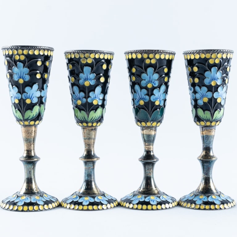 FOUR SOVIET SILVER-GILT ENAMELED VODKA CUPS: Marked for Leningrad Jewelry & Watch Factory, 1961 and silver purity mark 916, 3 3/4" high, total weight 195 grams.