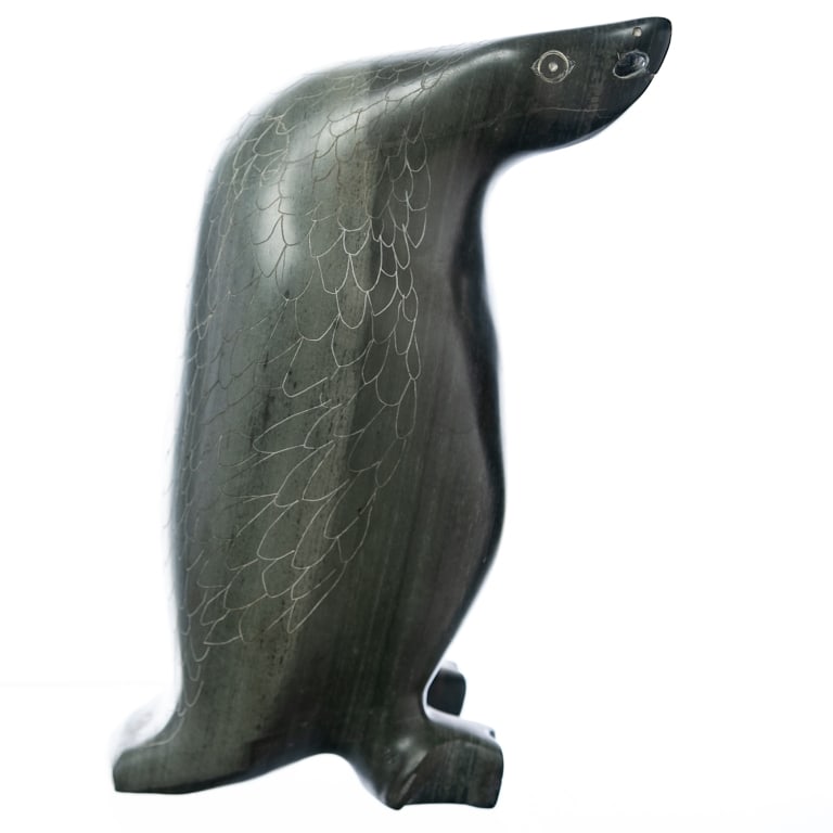 JOE EMIKOTAILAK (b. 1918 - ): Belcher Islands, carved green stone of a penguin, old paper label at base marked STEEVES, 20th century, 7 x 3 1/2 x 4 inches.