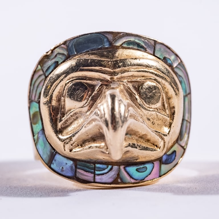 TONY HUNT SR. OBC, RCA (CANADIAN, 1942-2017): First Nations, an exceedingly rare and important 14KT gold ring designed and executed by Tony Hunt, Senior. The ring shows the mask of an Eagle surrounded by Abalone decoration. Stamped 14kt and the i