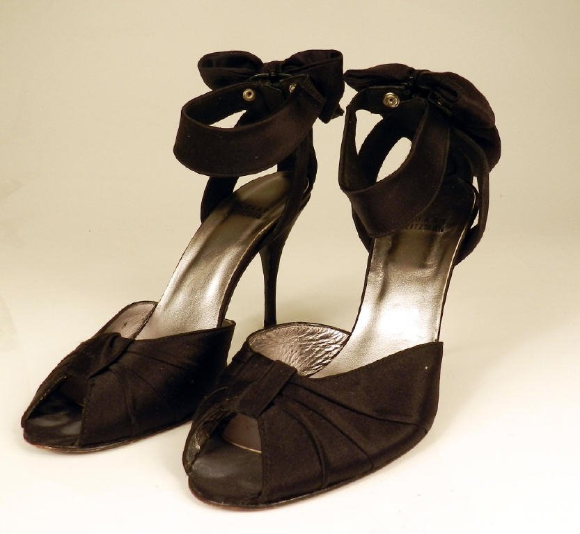 STUART WEITZMAN: Pair of black D'Orsay style shoes, rear zip with bow, very good condition, size 8
