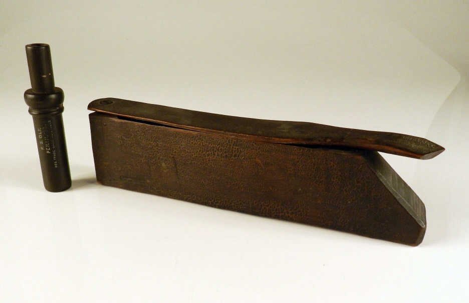 Antique turkey call: Antique Turkey call, 10 1/2 inches long, and a duck call by Psolt Pekin Illinois