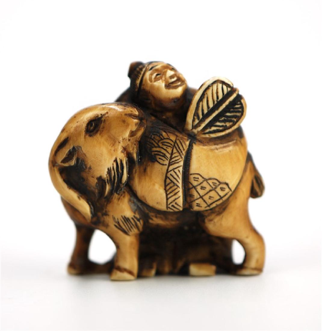 JAPANESE NETSUKE CARVED GOAT; EDO PERIOD(1603-1867): Of Fukurokuju-one of the 7 "Lucky Gods" of Japan- mainly associated with happiness and longevity. H: 1 1/2 in Â (3.8 cm ) W : 1 1/2 in Â (3.8 cm )