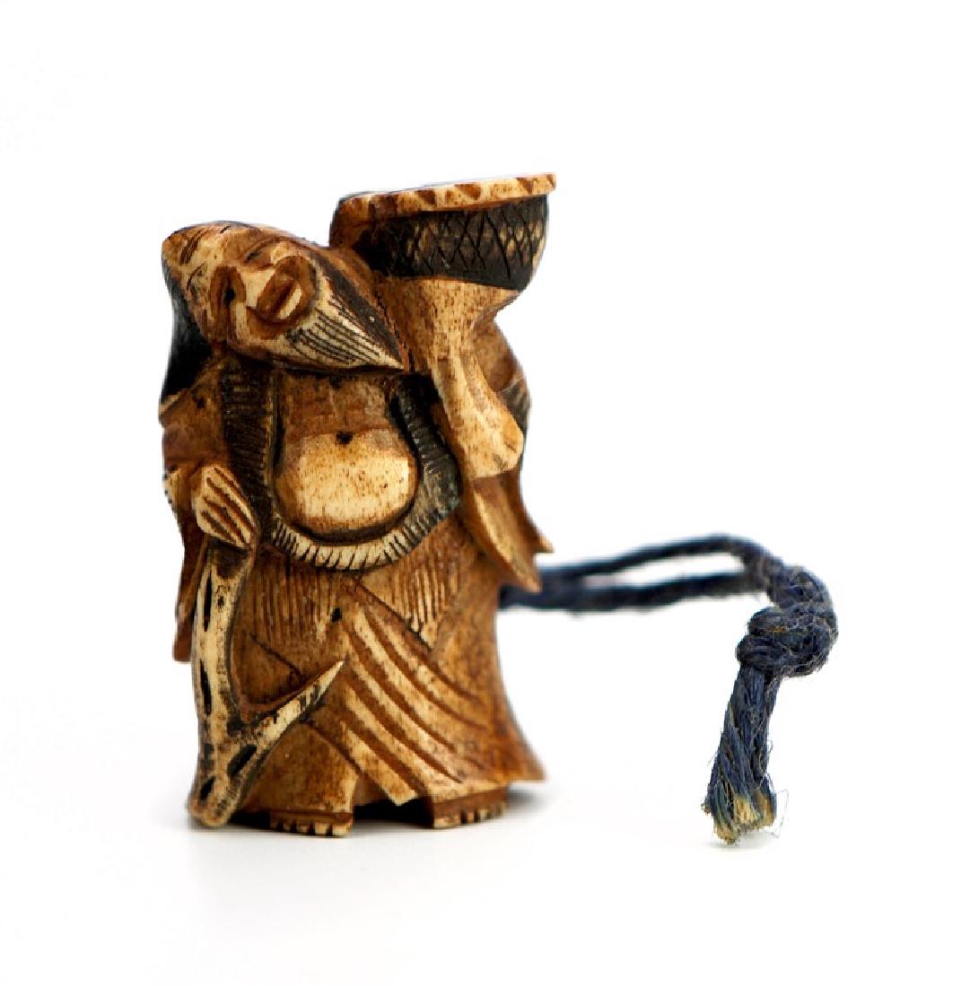 JAPANESE NETSUKE CARVED FUKUROKUJU; EDO PERIOD: A carved netsuke depicting Jurojin, Japanese god of longevity. HÂ 1 3/4 in ( 4.4 cm) W : 1 in (2.5 cm )