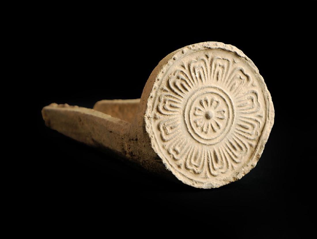 KOREAN CERAMIC ROOF TILES, SILLA PERIOD (669-935): This earthenware decorative roof tile has a flower motif design.Â Â Â H : 6 in (15.2 cm)Â L : 12 in (30.5 cm)