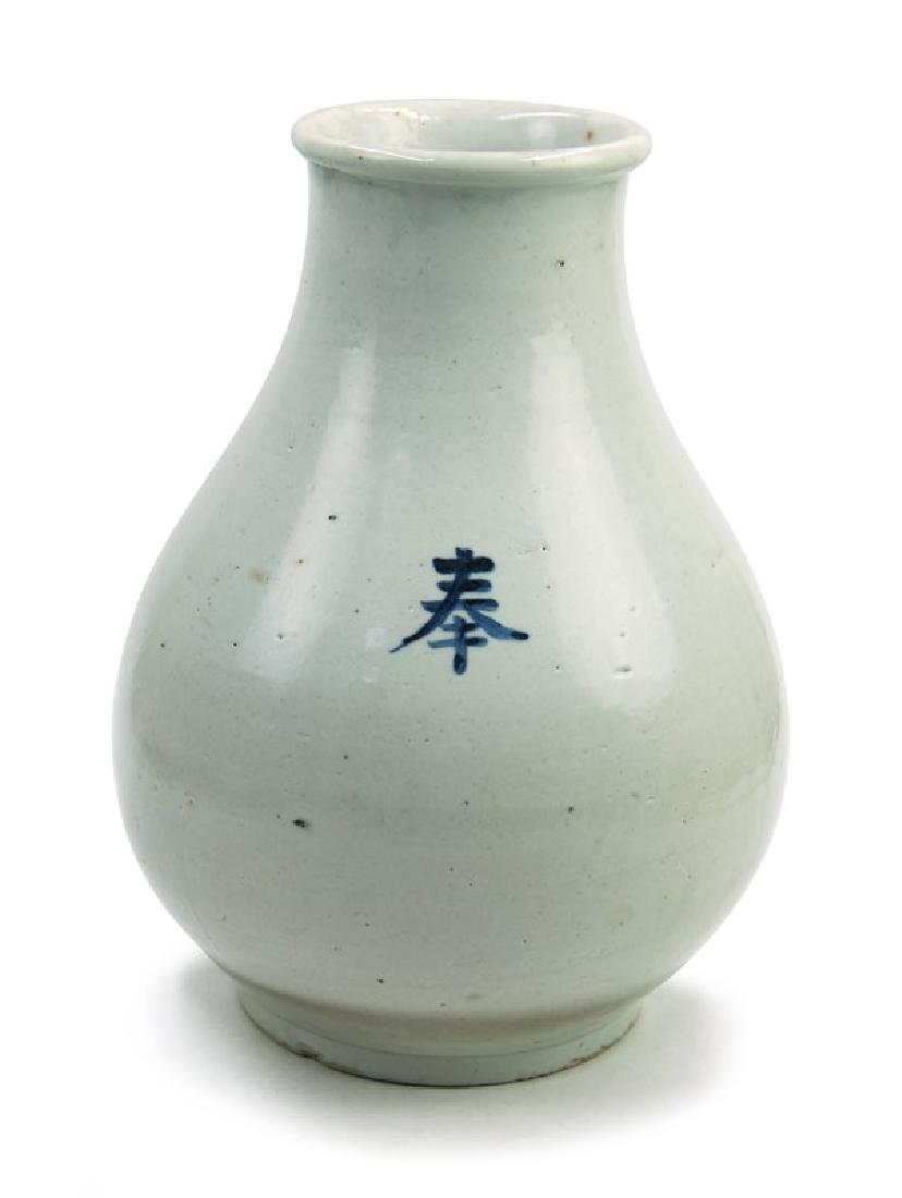 KOREAN WHITE VASE WITH CHARACTERï¼Œ JOSEON (YI): A white glazed vase with a fat body has a blue character "Feng" on it. H:11in (27.9 cm) W:8in (20.3 cm) M:3 3/4in (9.5 cm)