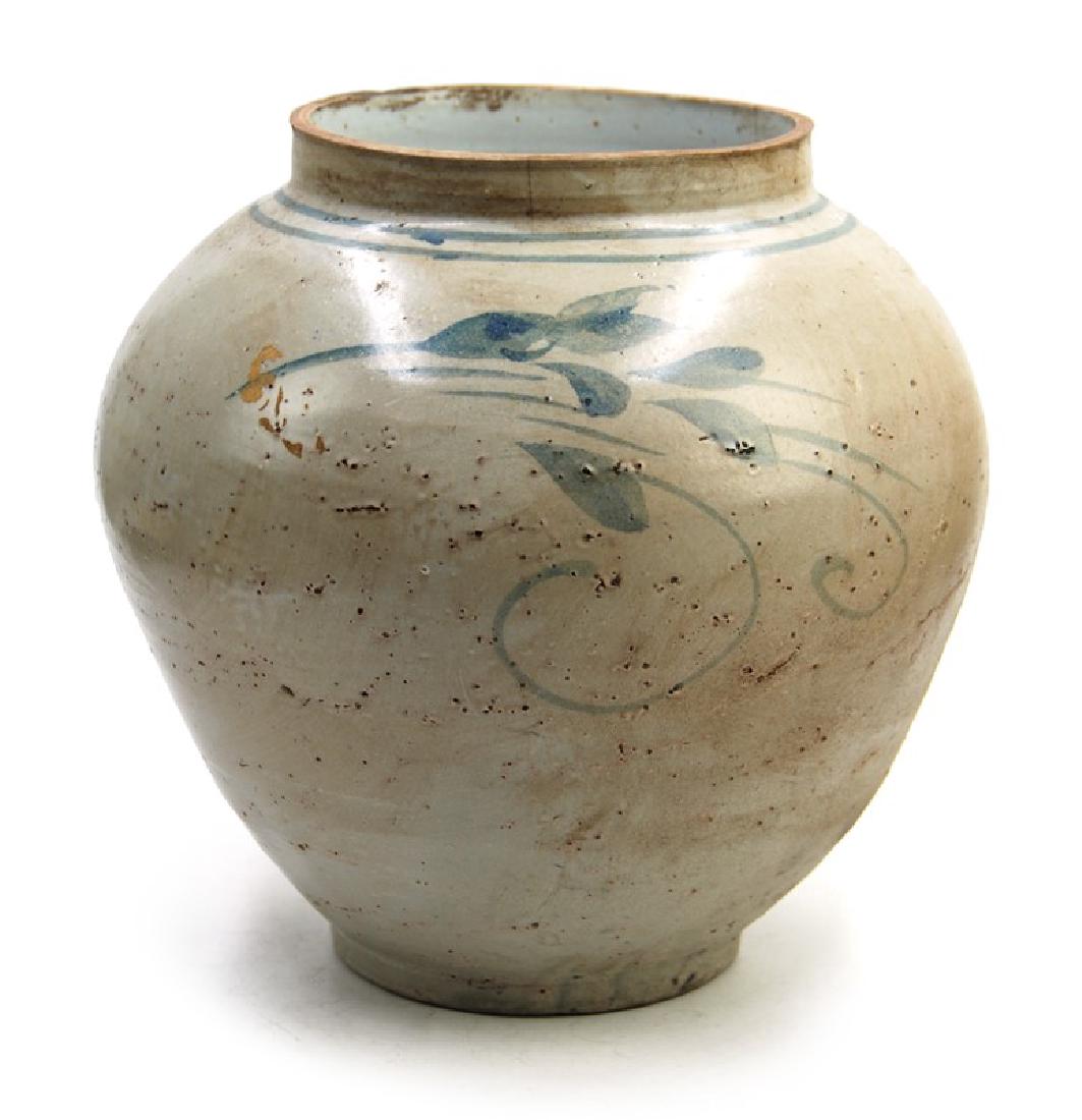 KOREAN DRK BLUE AND WHITE JAR: A korean blue and white jar, portrait of fish in the water, with double rings by its neck. H:9 1/2in (24.1 cm) W:9 1/2in (24.1 cm) M:5 1/8in (13 cm)