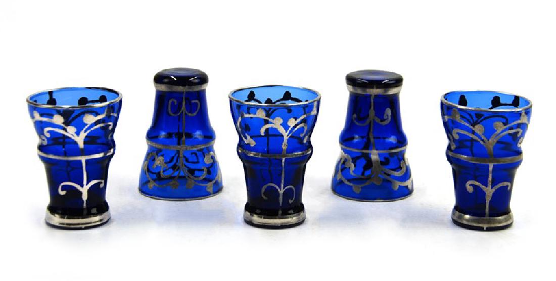 ANTIQUE ITALIAN COBALT SHOT GLASS SET: Group of five Italian cobalt shot glasses. decorated with hand applied silver, H:2 1/8in (5.3 cm) D:1 1/2in (3.81 cm)