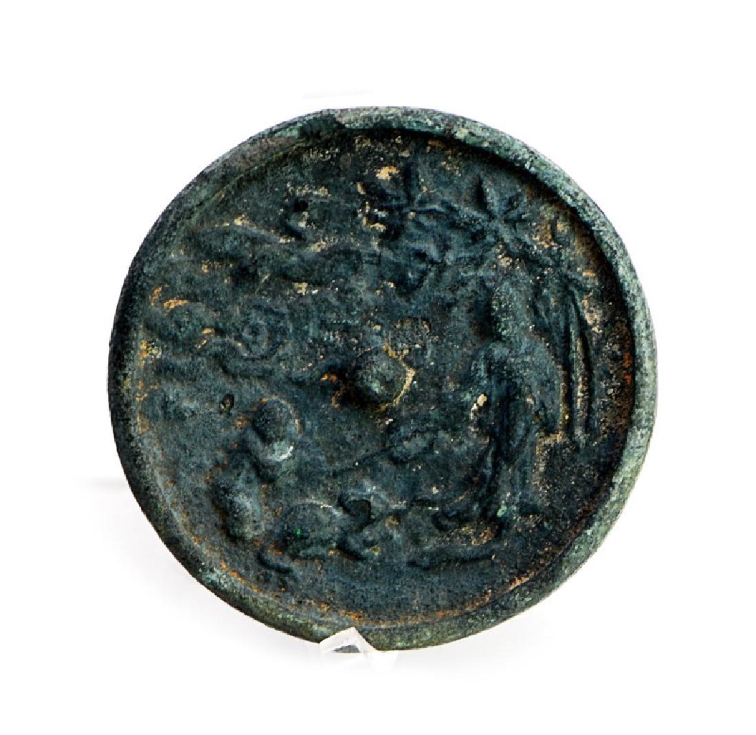 FIGURAL SCENE BRONZE MIRROR: A figural scene is featured on the back of this bronze mirror. D:3in (7.6 cm)