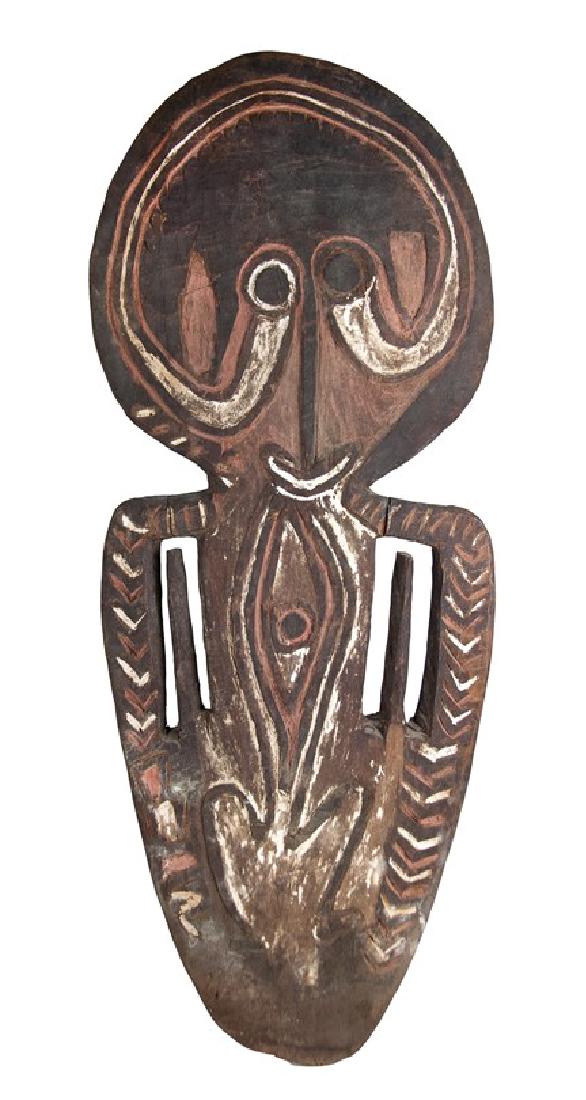 PAPUA NEW GUINEA SKULL RACK: OCEANIC, MALANESIA_x000D_ PAPUA GULF REGION, BAMU RIVER NEW GUINEA_x000D_ HAND CARVED WOODEN CEREMONIAL PIECE CARVED AGIBA _x000D_ This wooden rack is painted with black and white pigments, as a figur