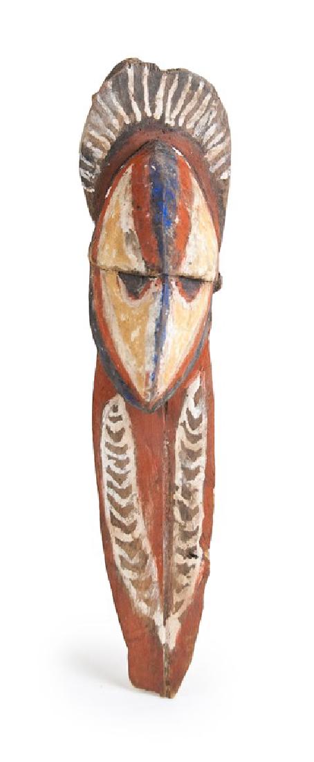 ABELAM WOOD CARVED MASK: This wooden mask is featured with an oval head with a blue ridged line that divides the face, and a long handle painted in orange with two white leaf patterns._x000D_ L:13in(33cm)_x000D_
