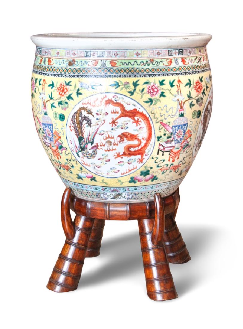 CHINESE YELLOW DRAGON PHOENIX BASIN WITH BASE: A large yellow ground basin, decorated with dragon and phoenix panels and alternating Buddhist symbols and flowers while the interior has a group of koi fish with algae. H:15 7/8in(40.3cm) D:17 3/4in(