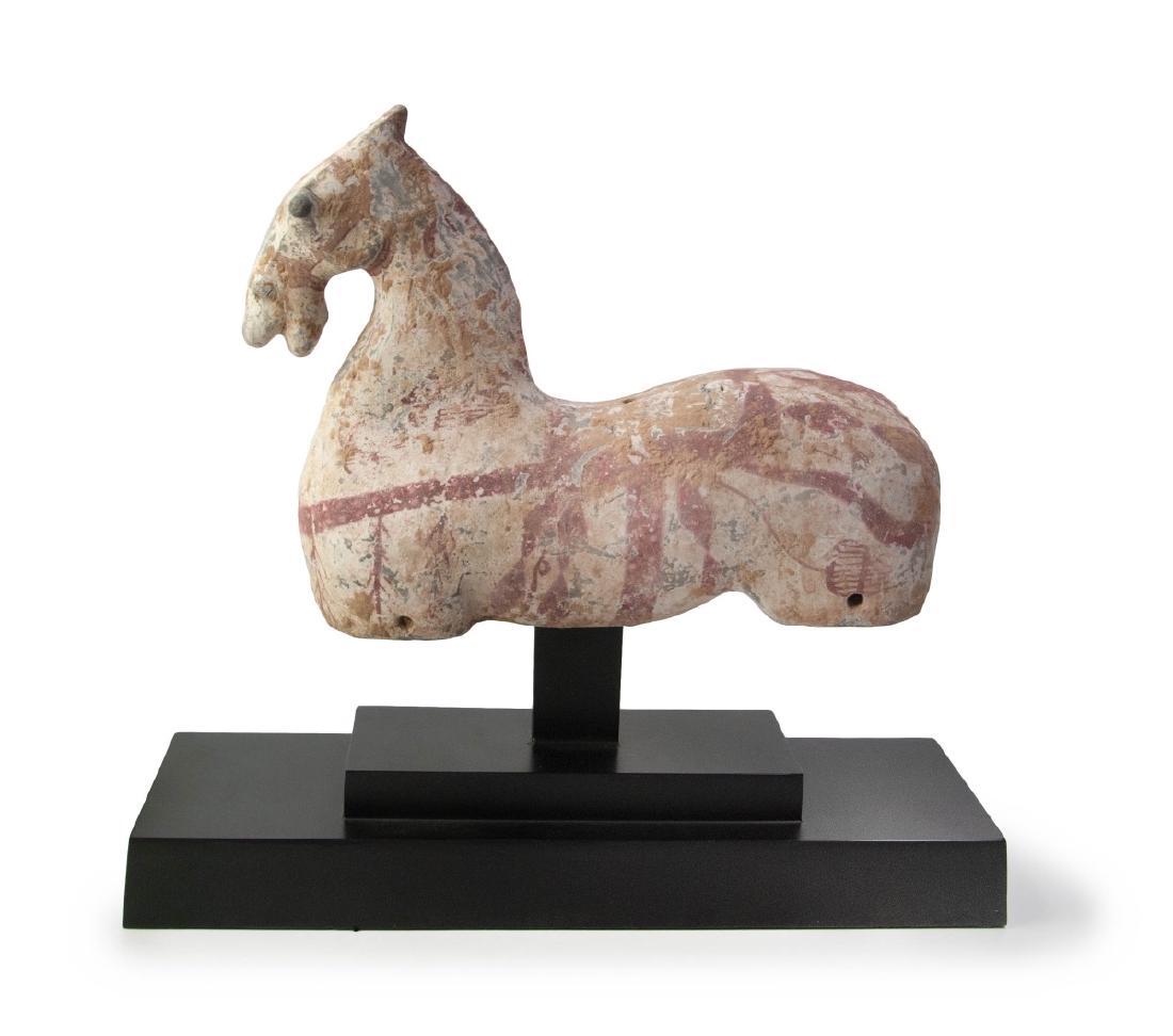 WESTERN HAN DYNASTY PAINTED POTTERY HORSE: Chinese Western Han-style pottery horse, with mouth agape, the body with some moulded features, on metal stand; H:13 3/4in(35cm) W:15in(38.2cm)