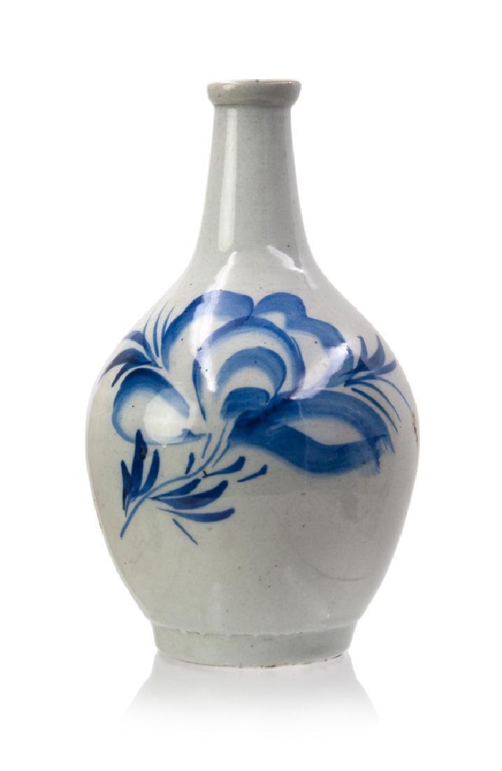 KOREAN BLUE AND WHITE BOTTLE: A Korean blue and white bottle decorated with peony patterns on the body. H:8in(20.3cm) W:4 1/2in(11.4cm)