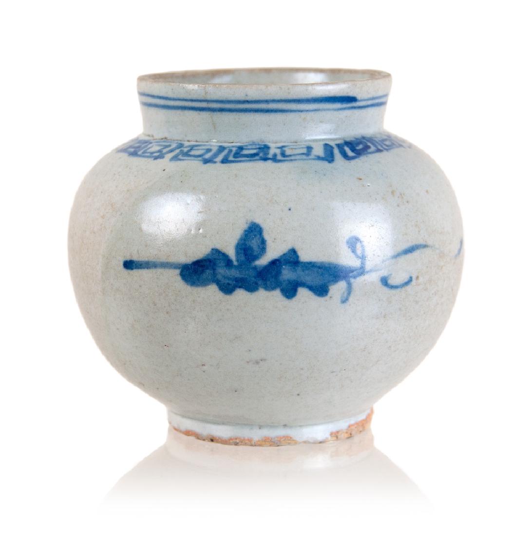 BLUE AND WHITE KOREAN JAR: A Fine Blue and White Porcelain Globular Jar: Korea, Joseon dynasty, 19th century The small jar of globular form resting on a ring foot and with an upright neck ending in a straight cut lip, painted i