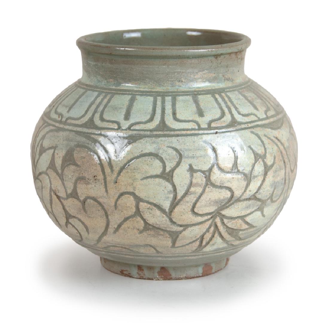 KOREAN ETCHED PATTERN JAR: Korean Fine Sgraffiato Designed Punchong Ware Jar-15th C.: Korea, Joseon dynasty, 15th -16th century Of pear form set on an inset, high ring foot, ornamented with a wide band of lotus leaves defined b