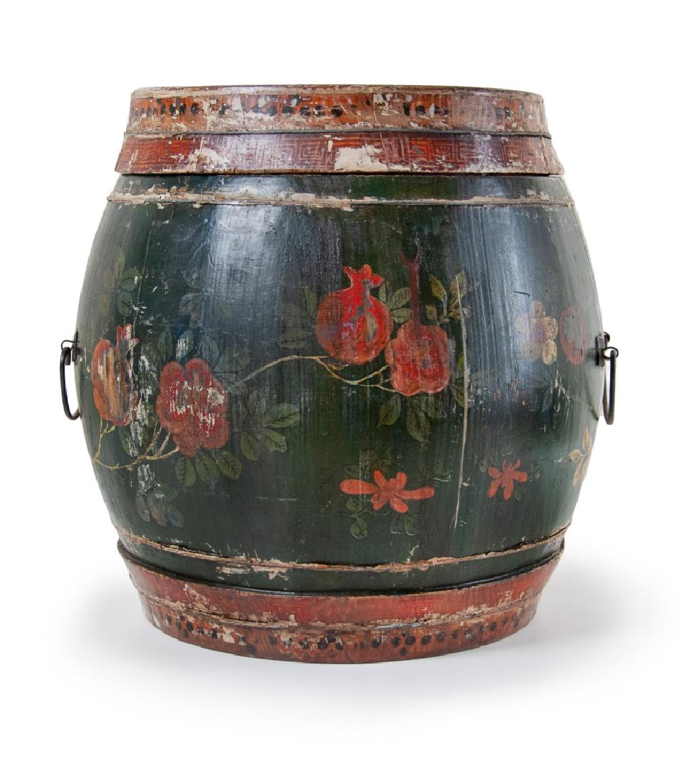 KOREAN POLYCHROMED TEA STORAGE: A wooden lacquered tea storage shaped like a barrel drum decorated with polychrome floral patterns with two C-shaped handles on two sides. H:12 1/8in(30.8cm) W:12in(30.5cm)