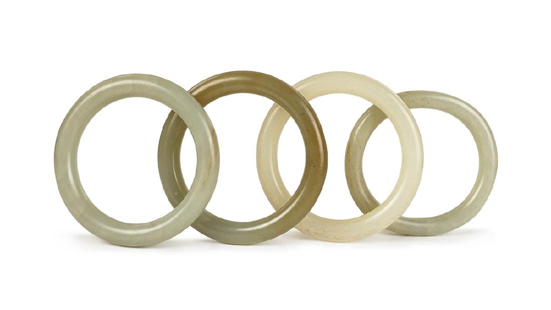GPOUR OF FOUR CARVED JADE BANGLES (1 of 1)