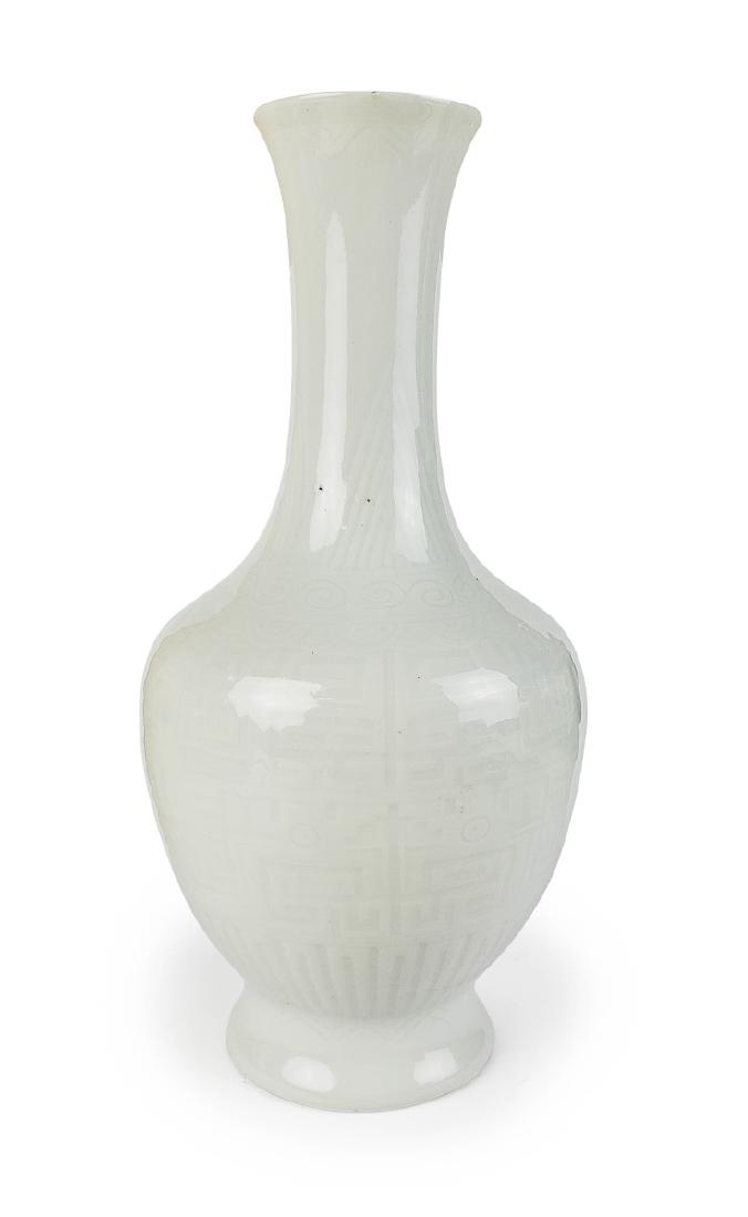 A WHITE-GLAZED CARVED ANHUA-DECORATED VASE (1 of 2)
