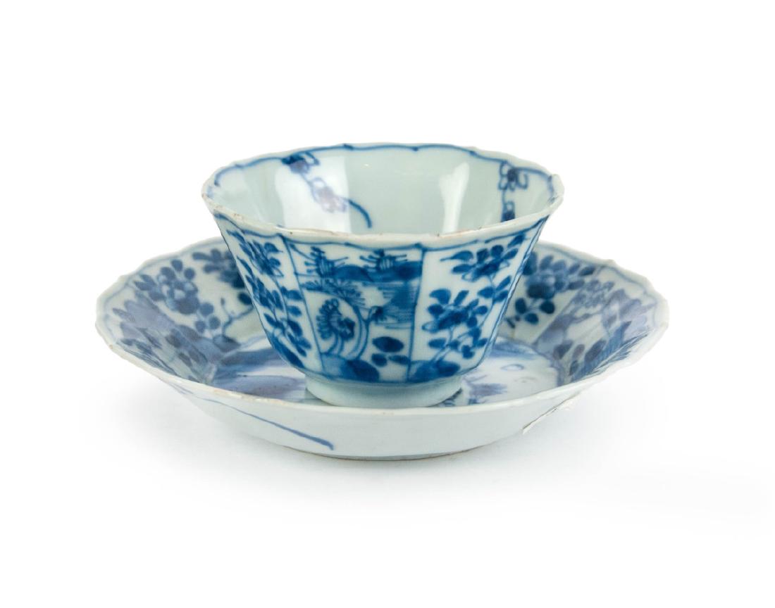 BLUE AND WHITE TEA CUP AND DISH: A set of blue and white tea cup and dish, of a lotus lobed design, painted with peony flowers and peach bloosm on the exterior. Cup-H:2in(5cm) D:3 5/8in(9.2cm) Dish-H:1 1/8in(2.8cm) D:5 1/2in(13.9cm)