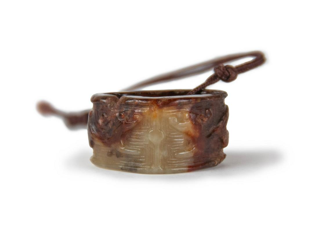 A CHINESE CARVED JADE RING SHAPED TOGGLE (1 of 1)
