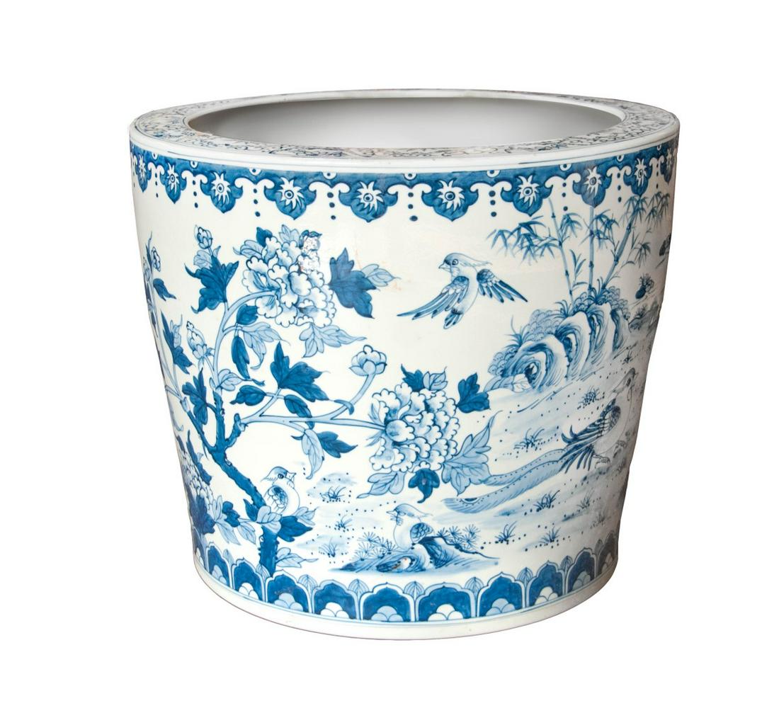 BLUE AND WHITE PORCELAIN DRAGON PLANTER: H:16in(40.6cm) D:19in(48.2cm) Provenance: Property from Arnold Kopelson collection