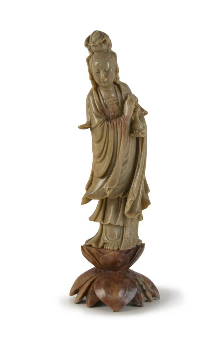 CARVED SOAPSTONE GUANYIN FIGURE: A Chinese soapstone standing figure of Guanyin with wood stand. H:12in(30.7cm) W:4in(10cm)