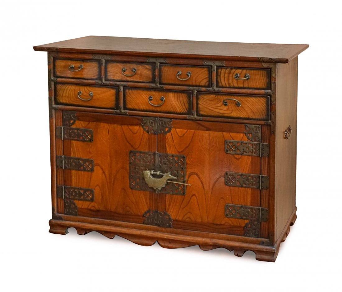 KOREAN WOODEN CHEST: The rectangular top above seven short frieze drawers and a cupboard surrounded by inlaid panels. H:34 3/4in(88.2cm) W:47in(119.3cm) D:17in(43.1cm)