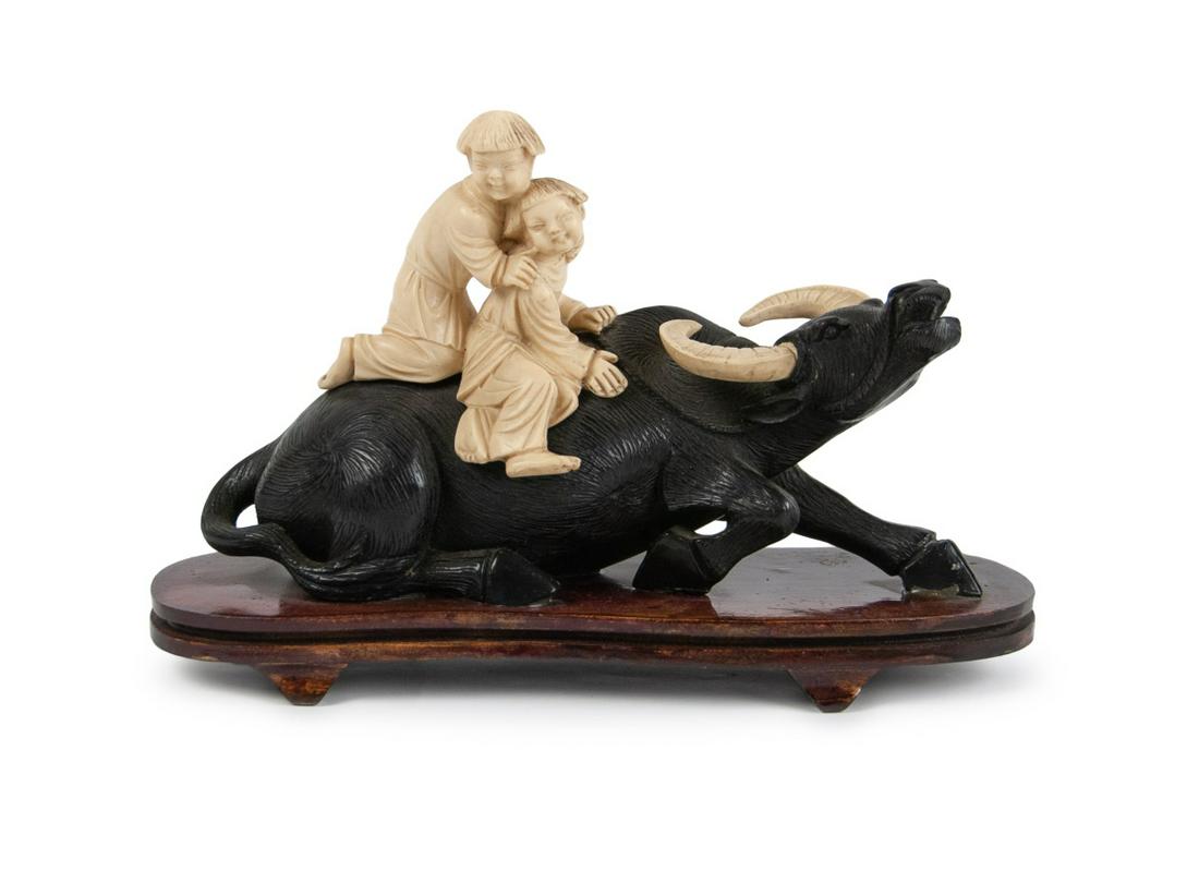 A CHINESE WOOD CARVED OX RESIN CHILDREN (1 of 4)