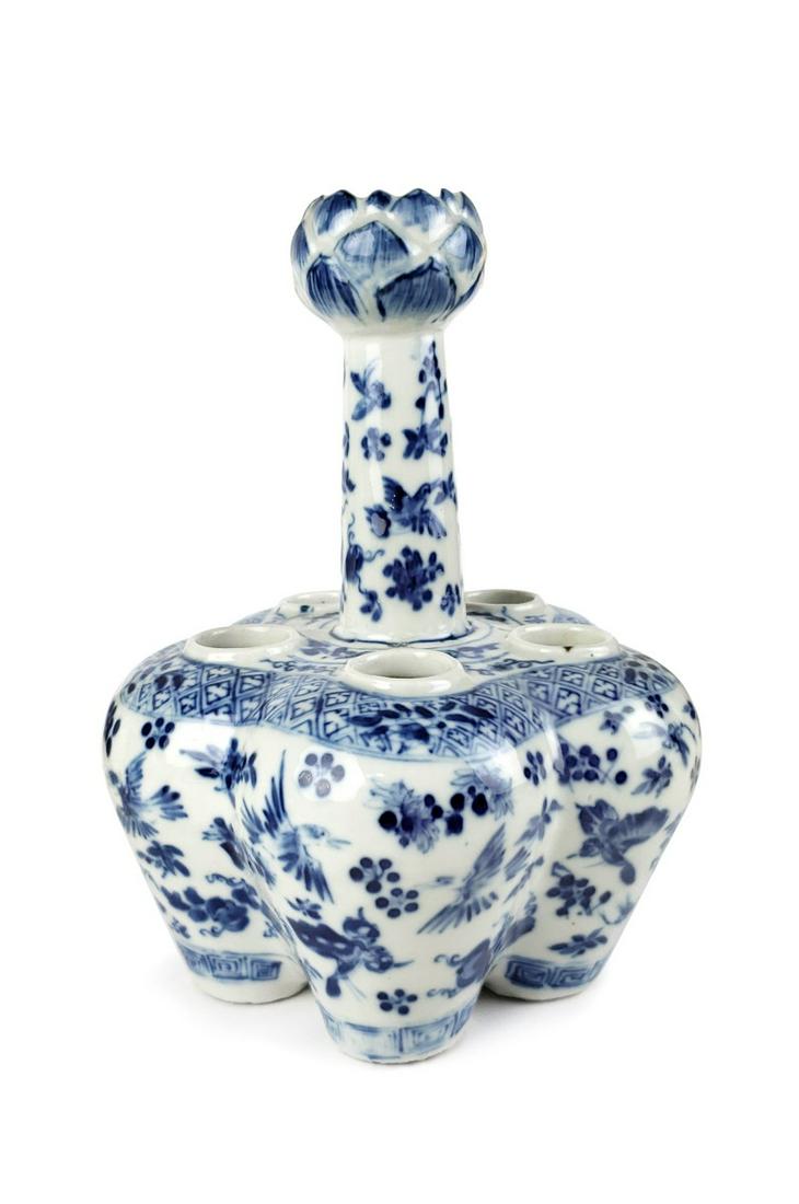 A CHINESE BLUE AND WHITE TULIP VASE: The central stem painted with birds amidst prunus and with flower head terminal above a base formed as five conjoined baluster vases, the lower section decorated with landscapes of flowers and birds,